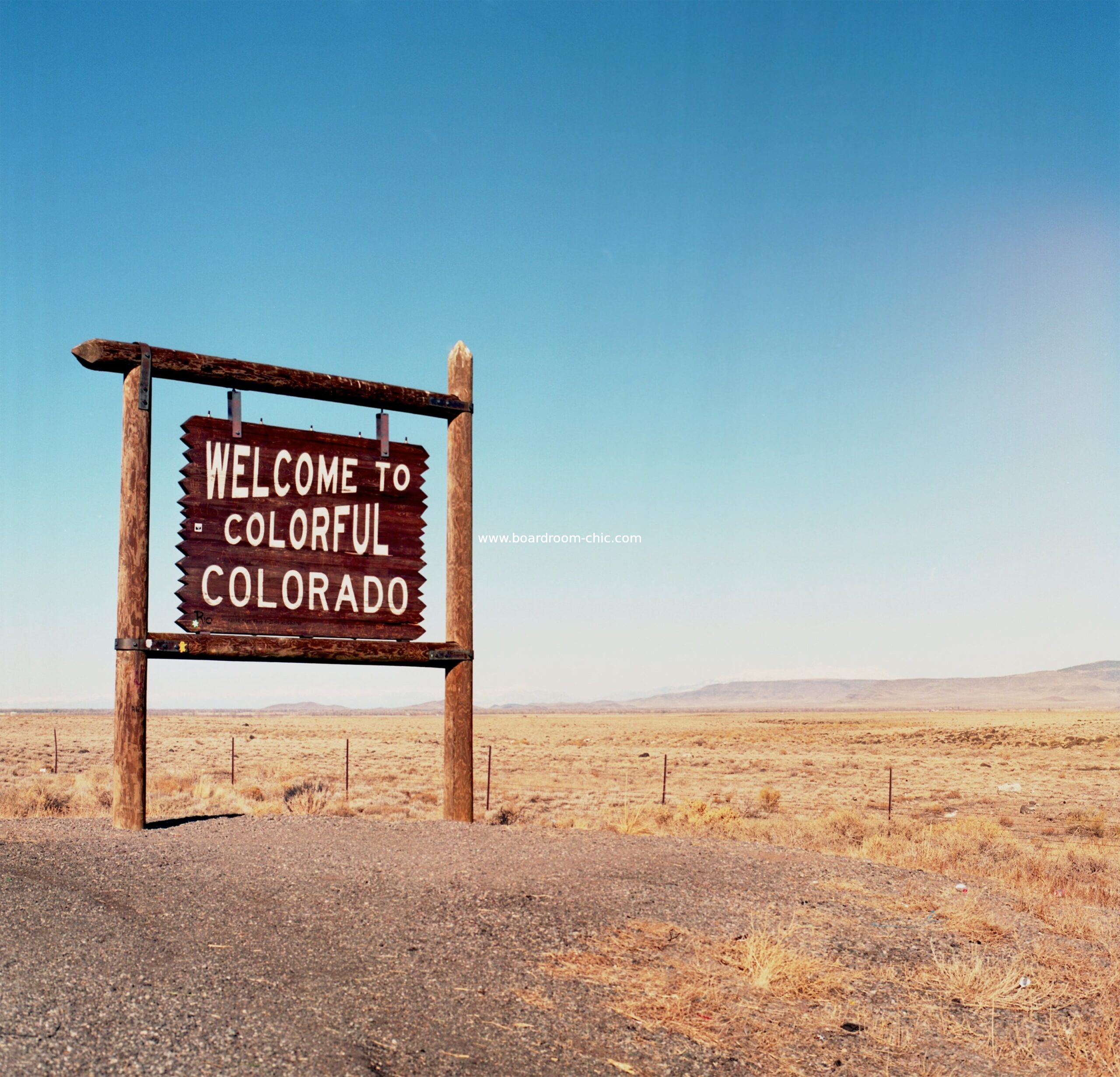 Welcome to Colorado - A scenic welcome sign against a backdrop blue skies, capturing the spirit of adventure in the Centennial State